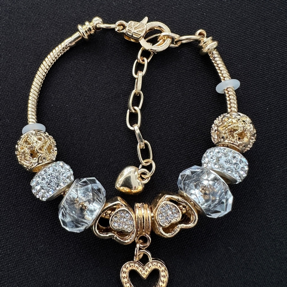 Elegant Gold and Silver Charm Bracelet